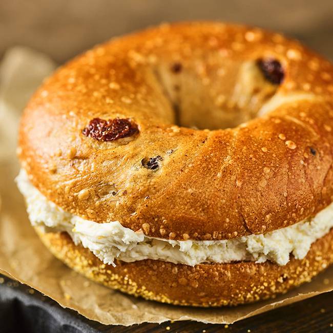 Einstein Bros Bagels Blueberry Bagel and Cream Cheese Image